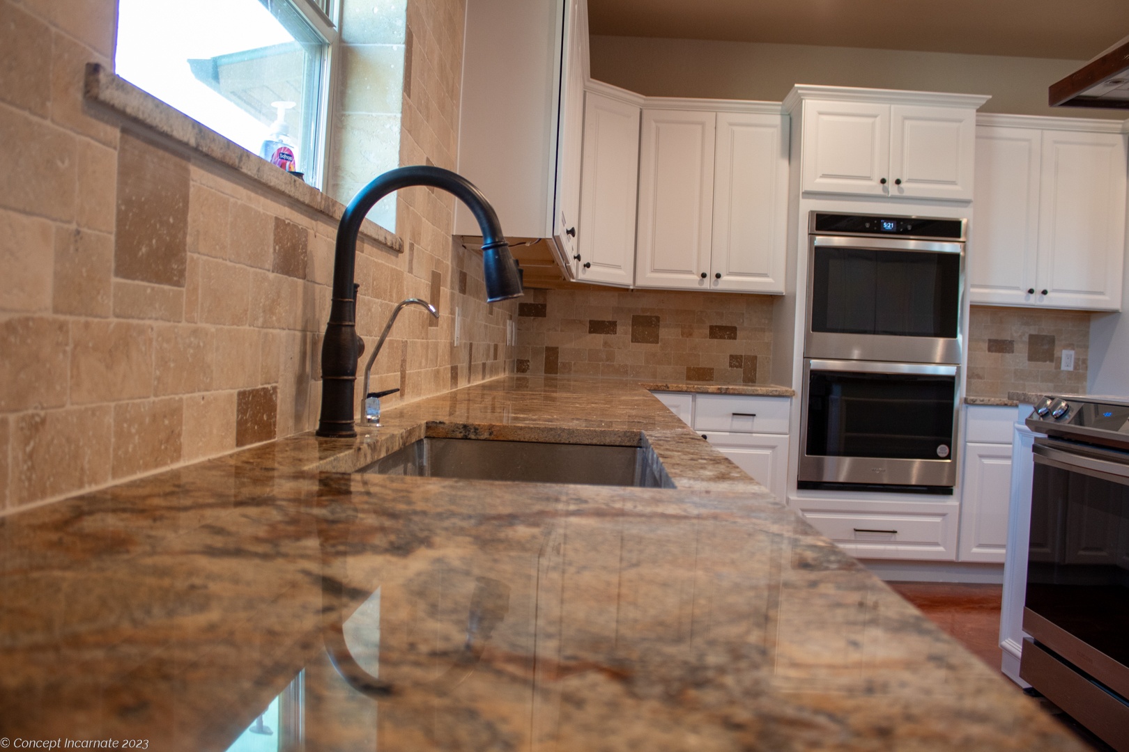 Undermount sink and granite counter in club house kitchen